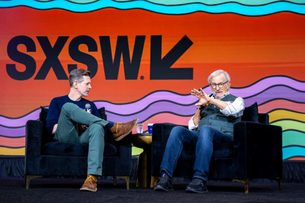 SXSW fireside chat featuring speakers discussing ideas on stage