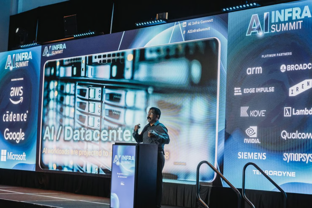 Speaker at AI Infra Summit podium presenting AI Datacenter