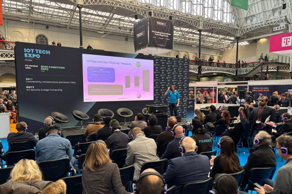 IoT Tech Expo audience attending a technology presentation on the expo stage