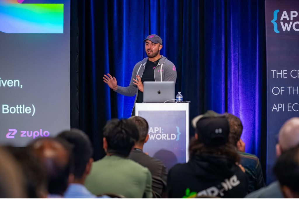 Speaker presenting technical insights at API World 2025