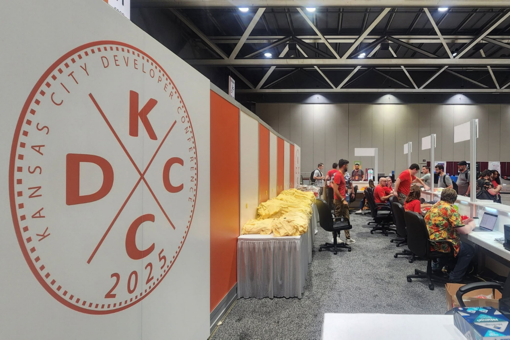 Attendees and volunteers at KCDC 2025 conference registration area