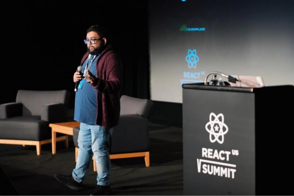 Speaker on the stage of React Summit US