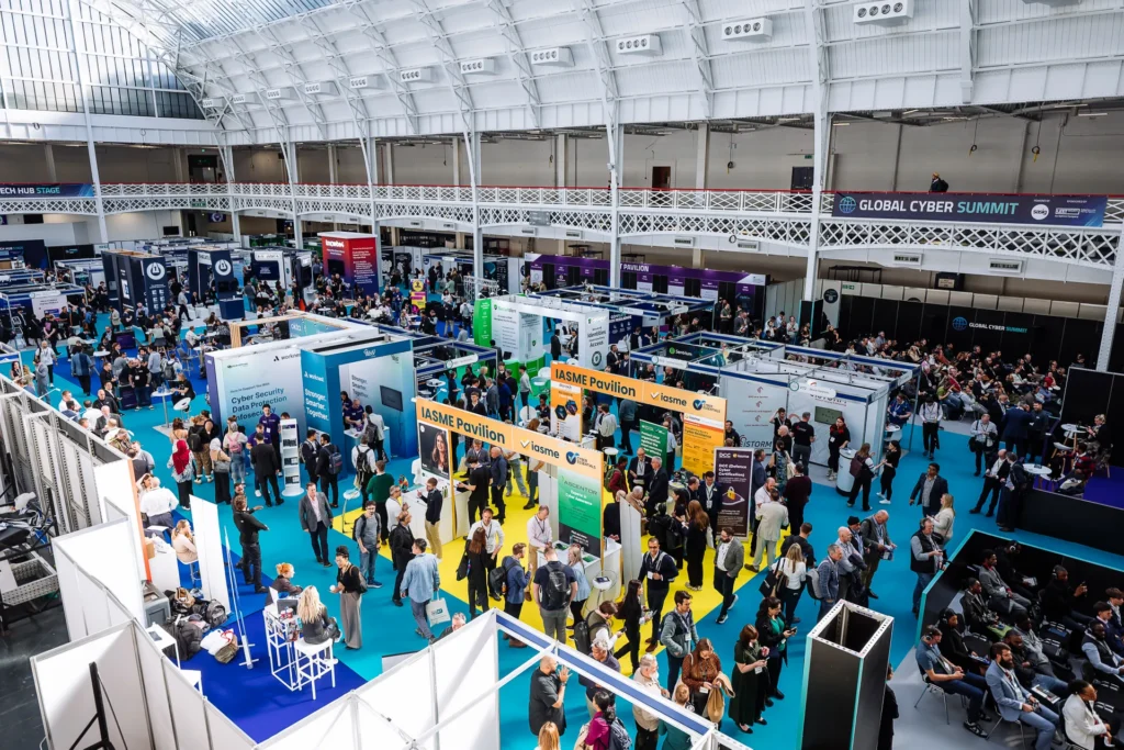 Large crowd of attendees and cybersecurity exhibitors at International Cyber Expo