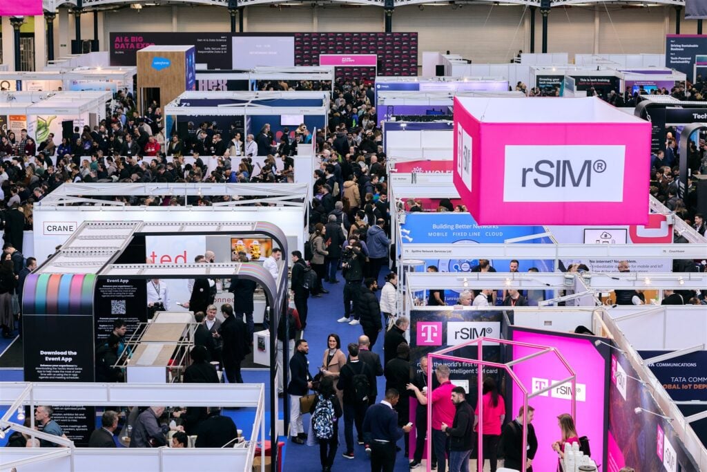 Attendees engaging and exploring the exhibition floor of the IoT Tech Expo
