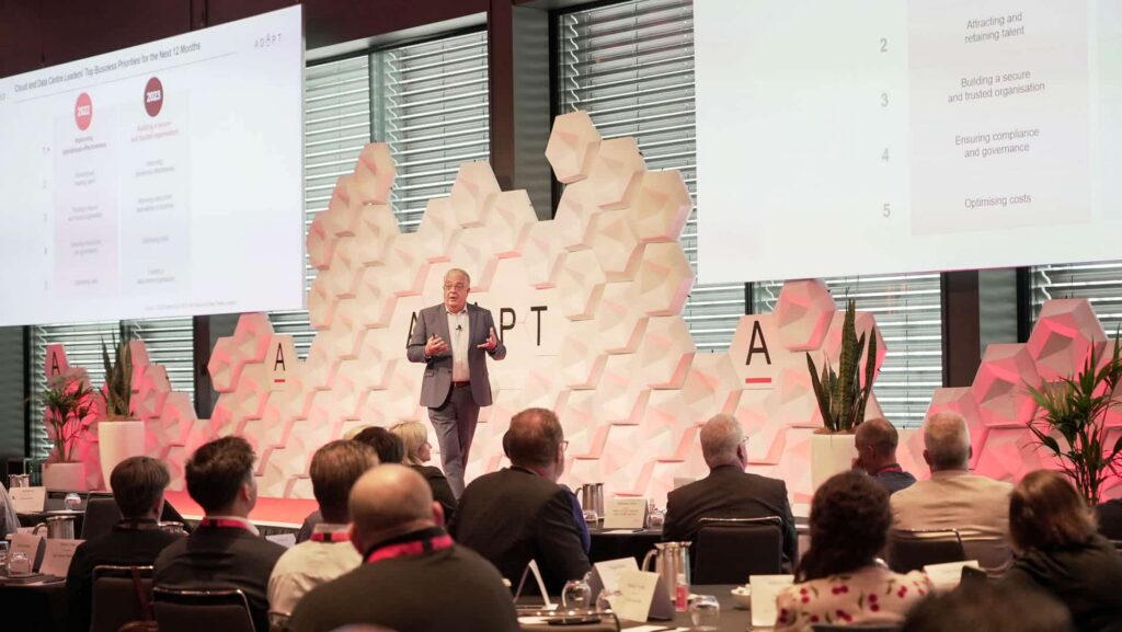 Speaker presenting business and technology priorities to an audience during the CIO Edge conference