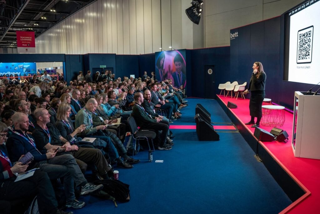 Speaker presenting an education-focused session to attendees at Bett Global