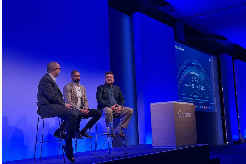 Panelistas compartiendo sus ideas en el escenario del Gartner IT Symposium/Xpo™
