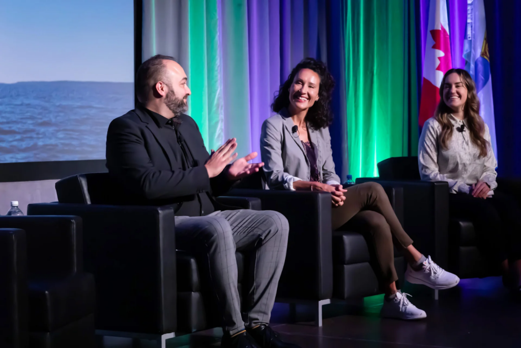 A panelist in discussion with other panelists at the NPI National Conference